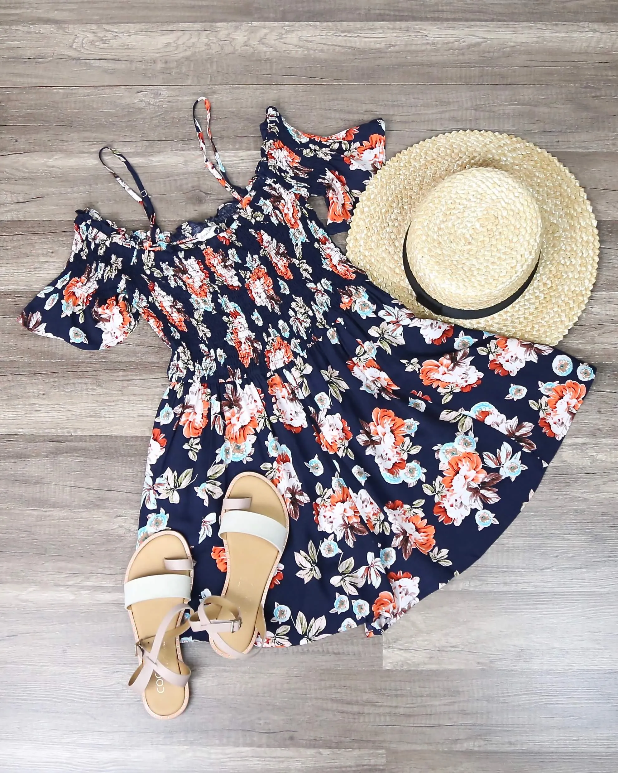 Final Sale - Smocked Cold Shoulder Romper in Navy Floral Print